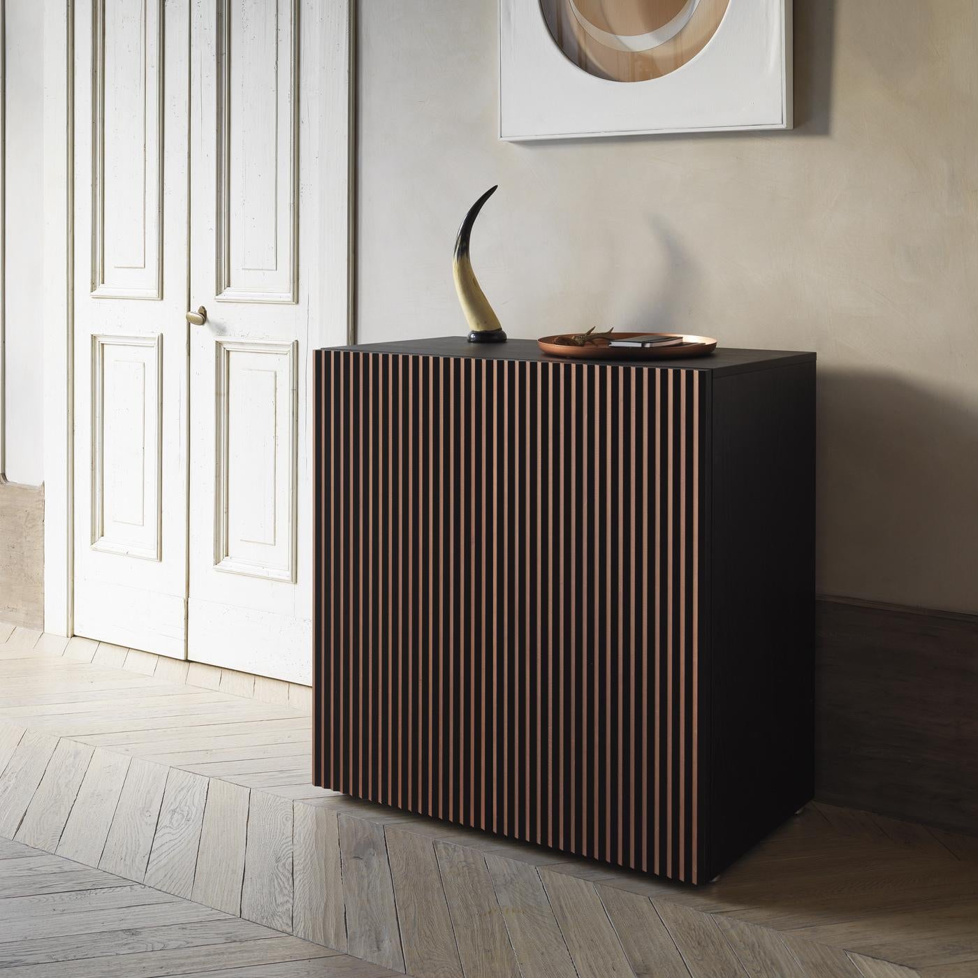 Exquisitely crafted of beechwood with a mocha finish, this two-door-sideboard by StH is a spacious and functional piece of decor, boasting a refined and sophisticated allure in an interplay of captivating optical effects. Looking at it from the