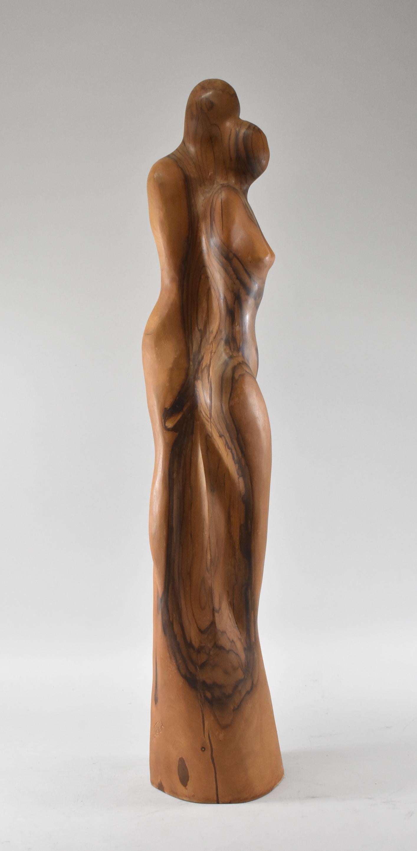 Hand carved Modernist olive wood sculpture of a man & woman by Russian artist Leon Bronstein. Born in 1951.