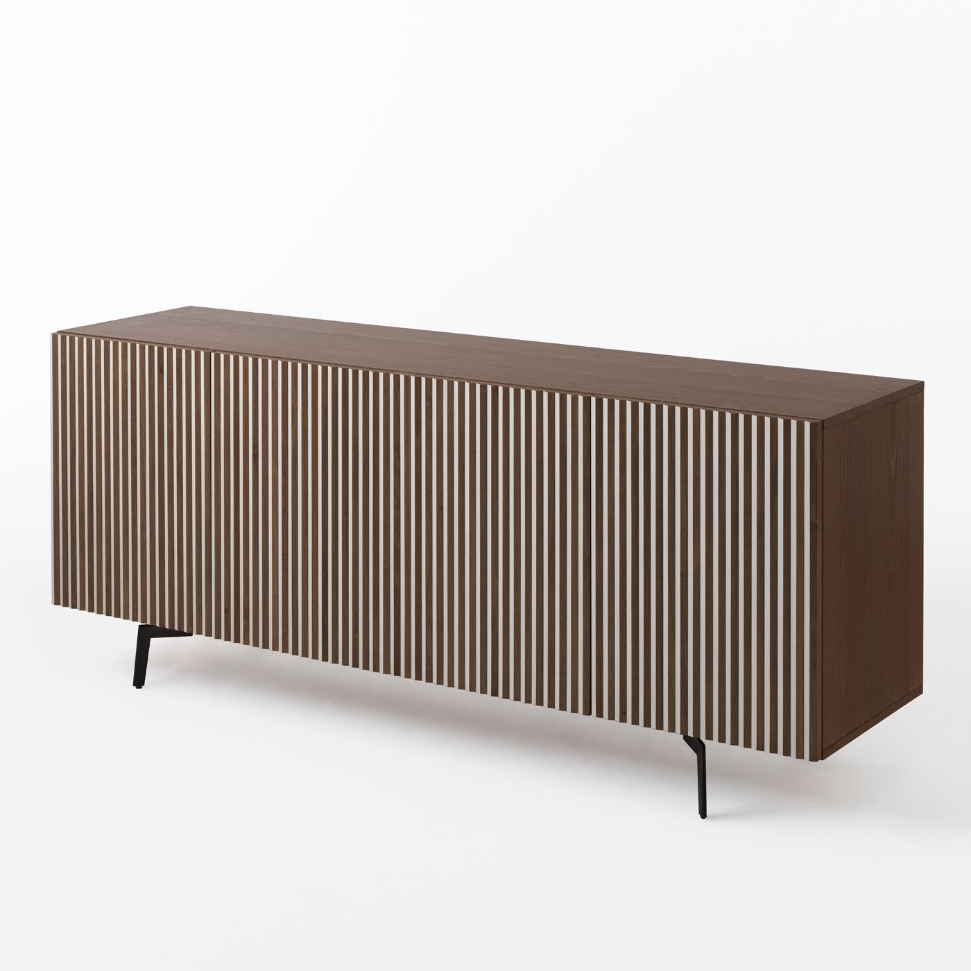 An exercise in contrasts, StH designed this striking piece of functional decor: A superb sideboard boasting captivating optical effect depending on the standpoint from which it is observed. Skillfully crafted of beechwood with a blonde finish, the