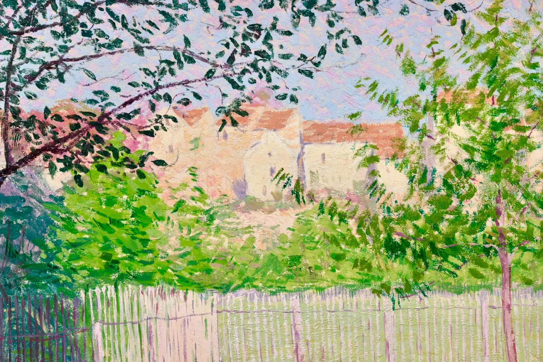 Signed impressionist oil on panel landscape circa 1900 by French painter Leon Giran-Max. The work depicts a view of fenced garden with pink flowers contrasting against the green foliage in the flower beds. Beyond the fence the houses of the town can