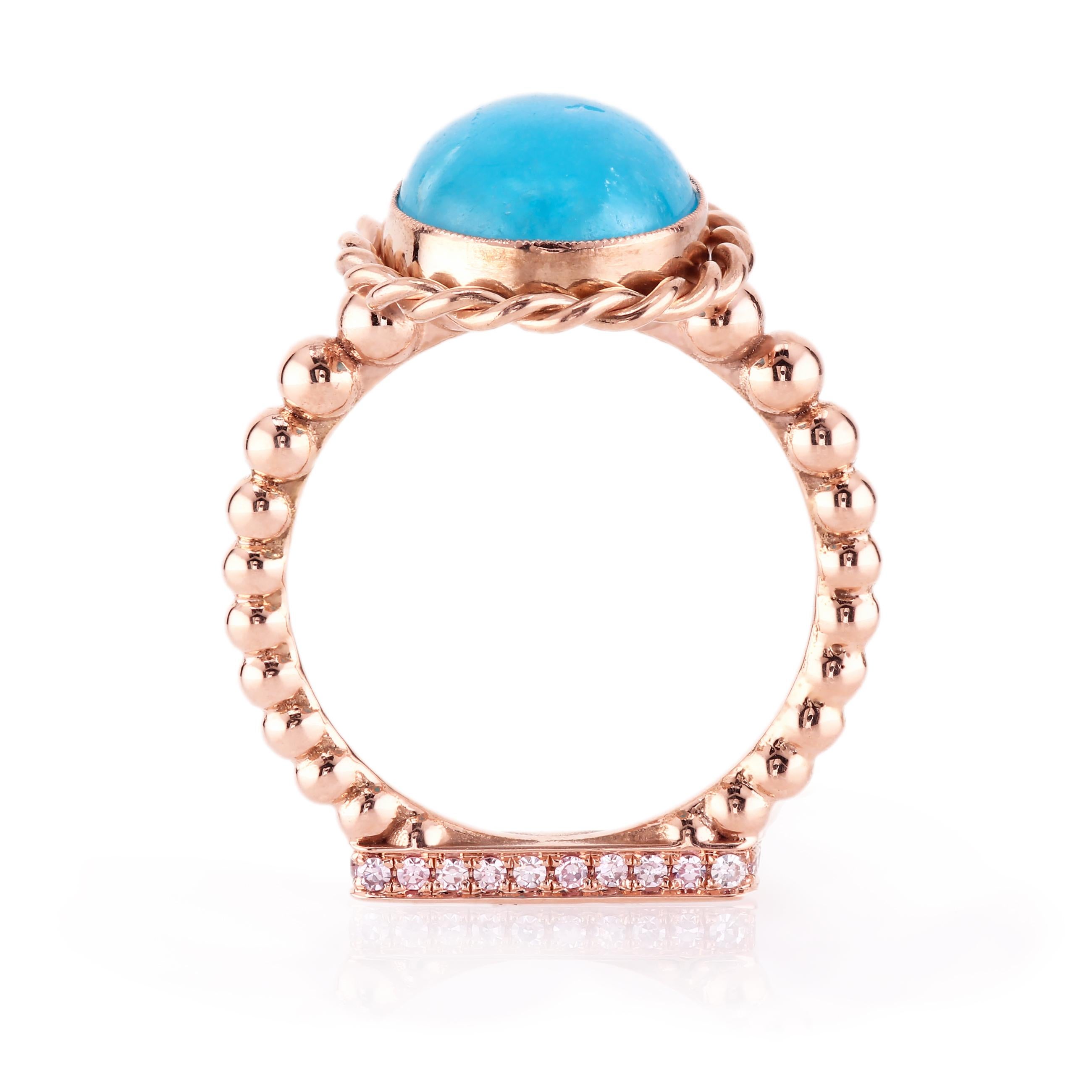 The pinnacle of American craftsmanship and design is on full display in this delicious 18 karat rose gold ring.
The ring is set with lovely hemimorphite cabochon chosen for its superlative quality and lovely blue color.
The stone's color mimics the