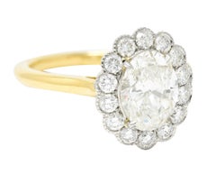 Leon Megé 2.30 Carats Oval Cut Diamond Platinum 18 Karat Yellow Gold Halo Ring
