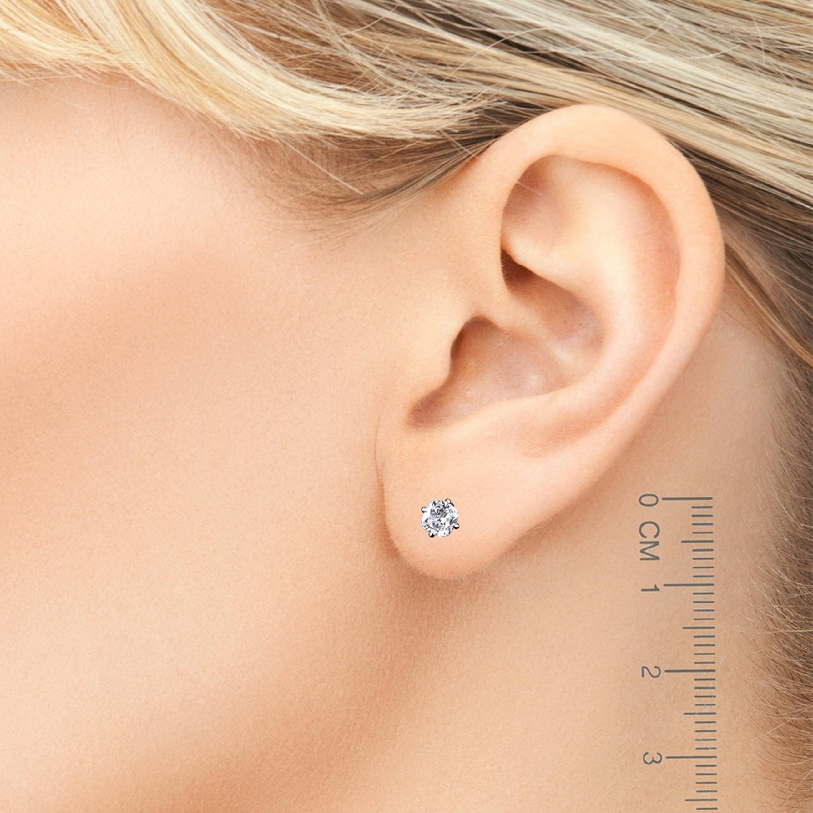 Pair of platinum studs with little pillow-shaped F/VS diamonds just over 0.25 carat each with the simple push-back butterfly earnuts. 
Our True Antique™ diamonds are hand-cut in New York by artisans using the same techniques used by diamond cutters