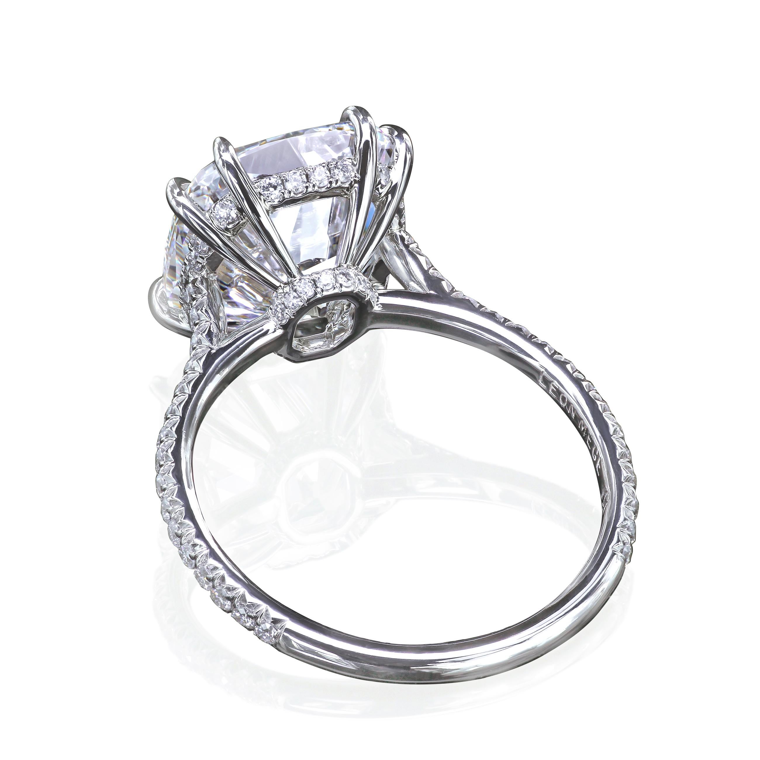 Solitaire engagement ring featuring a True Antique cushion cut diamond at the center.
The timeless design is completed with micro pave diamonds on the basket holding the diamond and cathedral shank.
Hand-forged platinum

All fine details of the