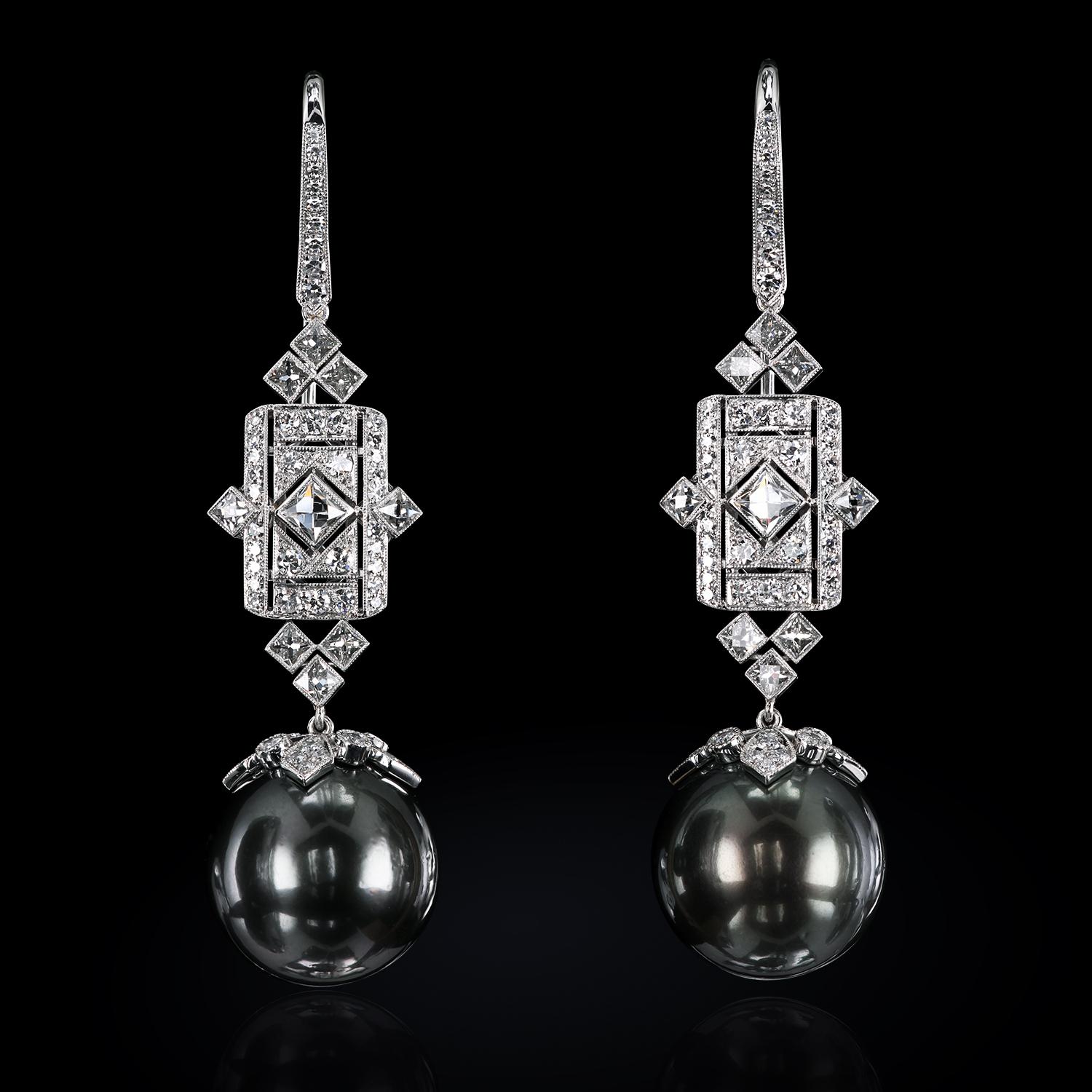 We are presenting you with the magnificent Art Deco-style diamond chandeliers set with French-cut diamonds. High-luster black South Sea Pearls are flexing their mussels for your enjoyment.
78 single cut diamonds 0.85 ctw
18 French cut diamonds 1.65