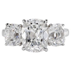 Leon Mege Bespoke Platinum Three-Stone Ring with Antique Cut Cushion Diamonds