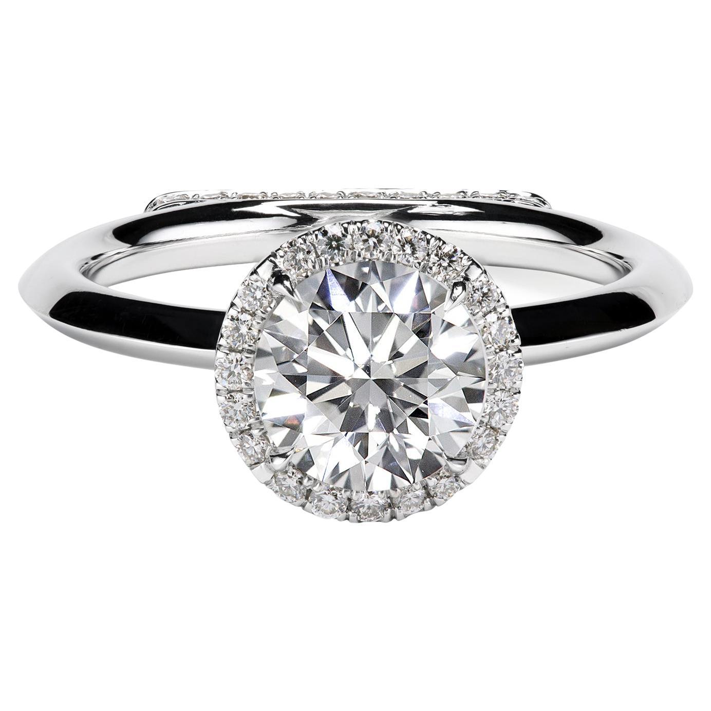 Leon Megé Daytona engagement ring with a round diamond and pave-set podium base