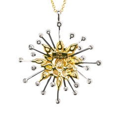 Colgante Leon Mege "Sueño de infinito" de oro con diamantes amarillos y blancos.