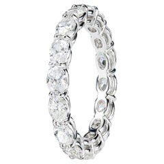 Leon Megé East-West  bespoke platinum eternity band with natural oval diamonds