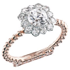 Used  Leon Mege elegant halo ring with round diamond in platinum and 18K rose gold 