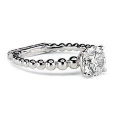Leon Mege Elegant Rosary Platinum Solitaire with Pave-Set Podium