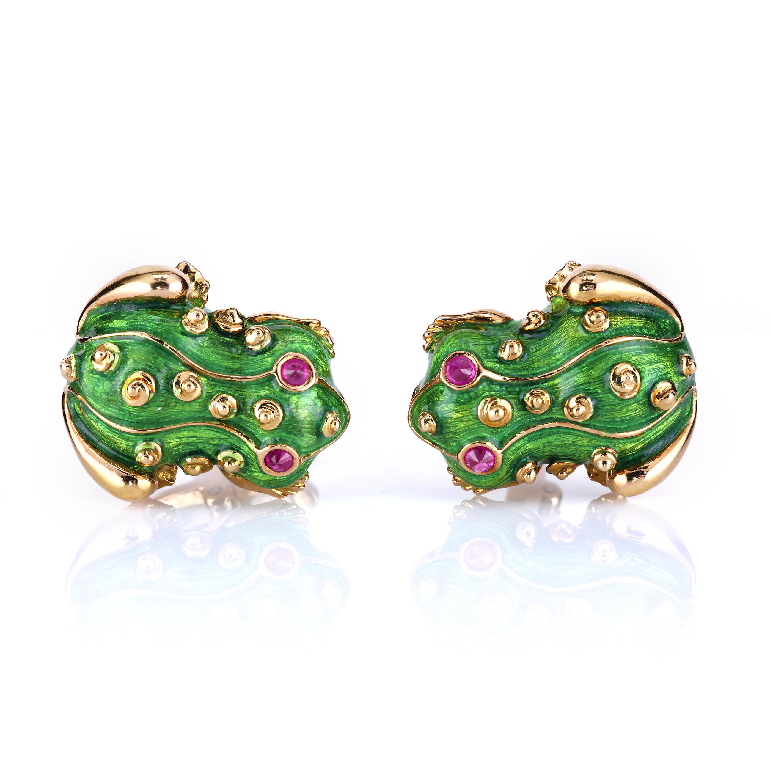 The frog cufflinks are beautifully rendered in Guilloche enamel in vibrant shamrock green color layered over 18K patterned gold and inset with exquisite rubies (set upside-down for a dramatic effect). 
Guilloche (Basse Taille) vibrant green