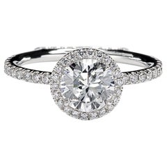 Leon Mege "Jesolo" platinum halo engagement ring with natural round diamond