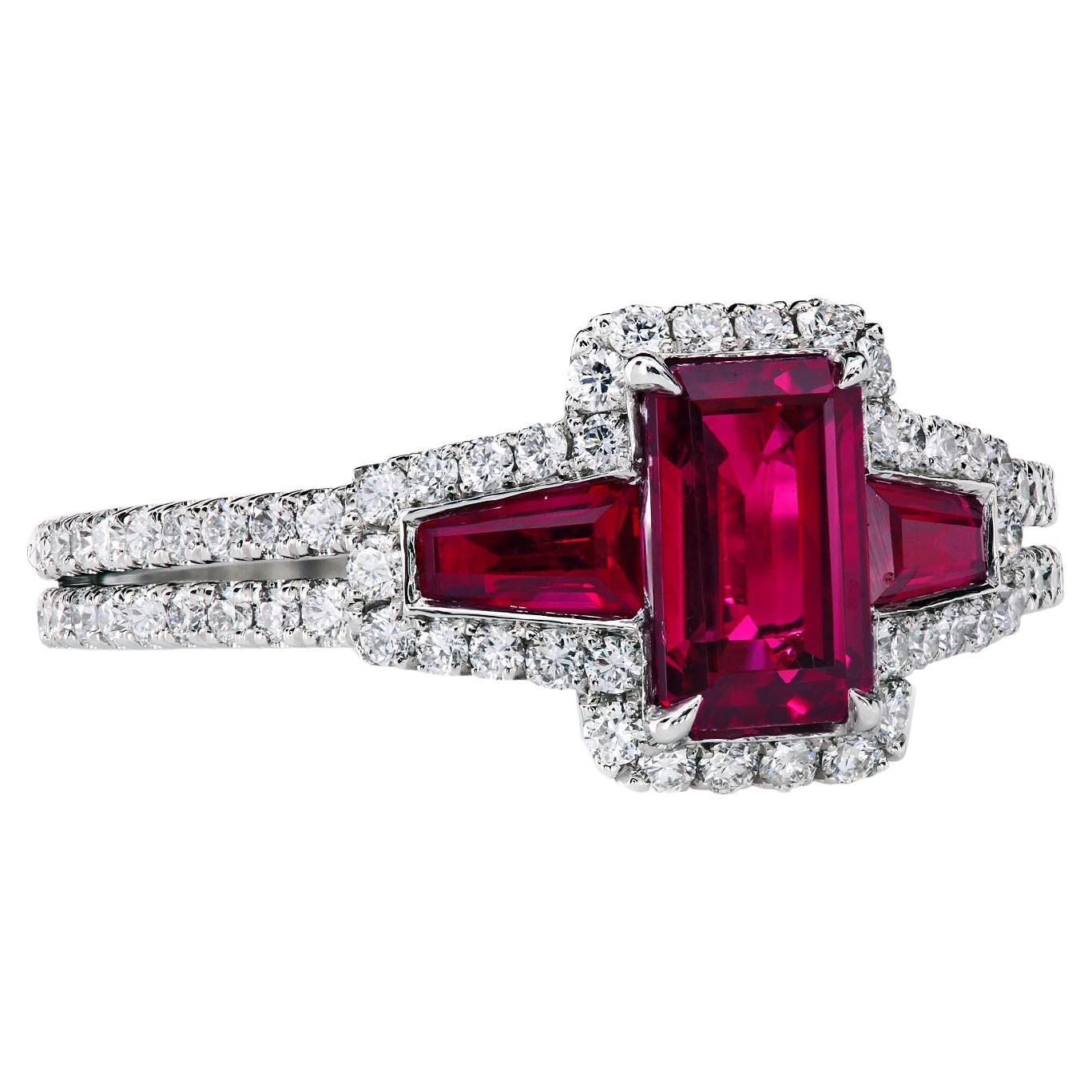 Three-stone ring with a 1.06-carat natural gem Thai ruby, certified by AGL CS1074721 and two natural rubies, tapered-baguettes 0.43-carat total.
The rubies are wrapped in 90 full cut F/VS ideal-cut diamonds, 0.58-carat total.
The hand-forged