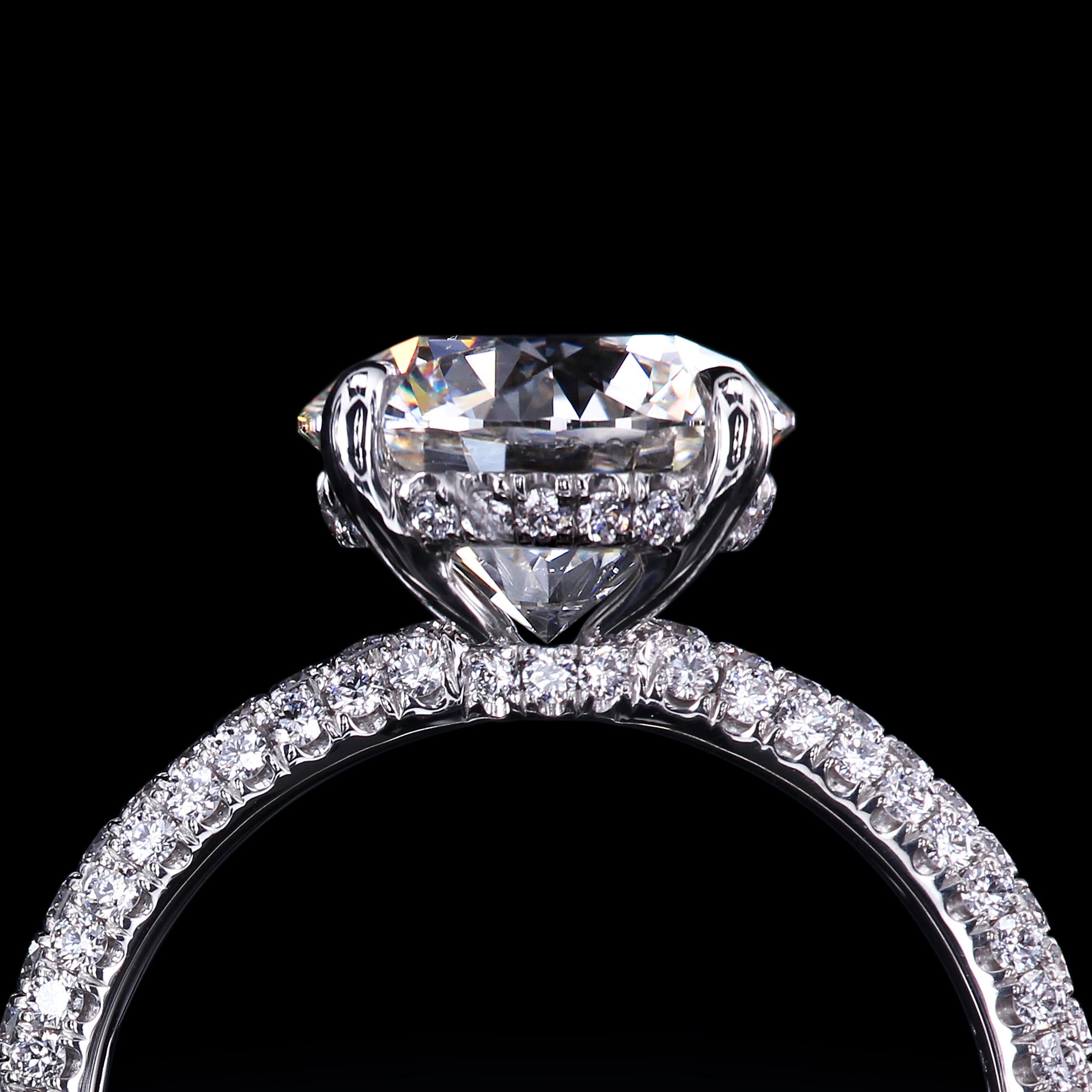 Bespoke solitaire ring custom-crafted by hand and set with three row of micro pave. 

The lead time for project completion is approximately four weeks.

Custom made pieces are NOT RETURNABLE; they are offered as a FINAL SALE only. You can have the