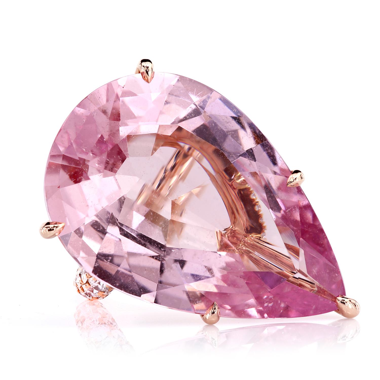 The statement ring featuring a certified 35.73 carats pear-shaped natural pink morganite; GIA #1152101549.
The stone is set in a bespoke 18K rose gold mounting consisting of a diamond micro pave-encrusted basket and pave-set shank with three rows of