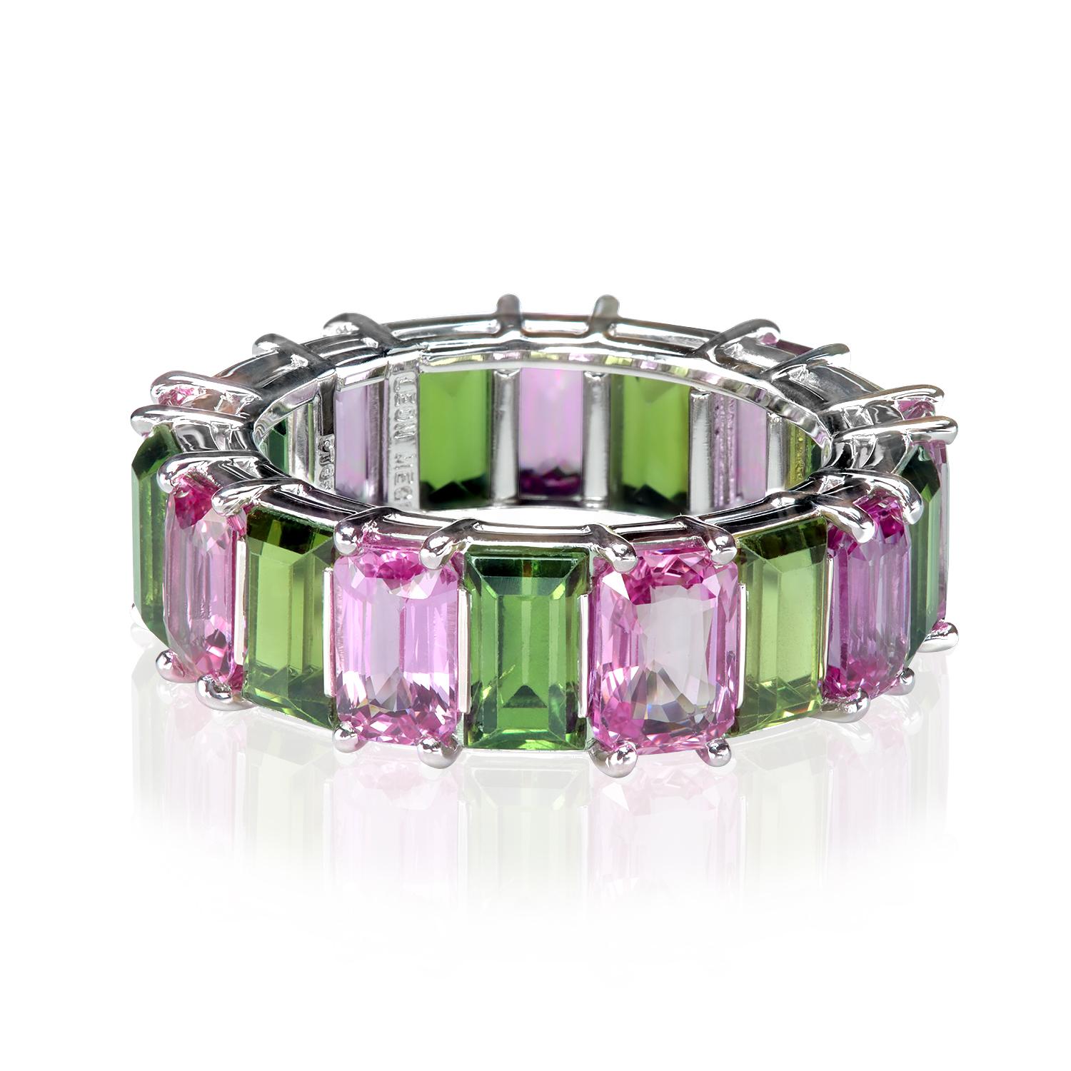 Organically festive platinum shared-prong band with 18 alternating pink and olive-green sapphires over 12 carats in total. The band is carefully crafted by hand in New York by Leon Mege jewelers is approximately 7.2 mm wide. A rare and wonderful