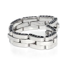 Leon Mege platinum flexible wedding band with the edge of black diamonds