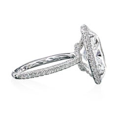 Leon Mege platinum halo ring with 3.01 ct oval diamond.