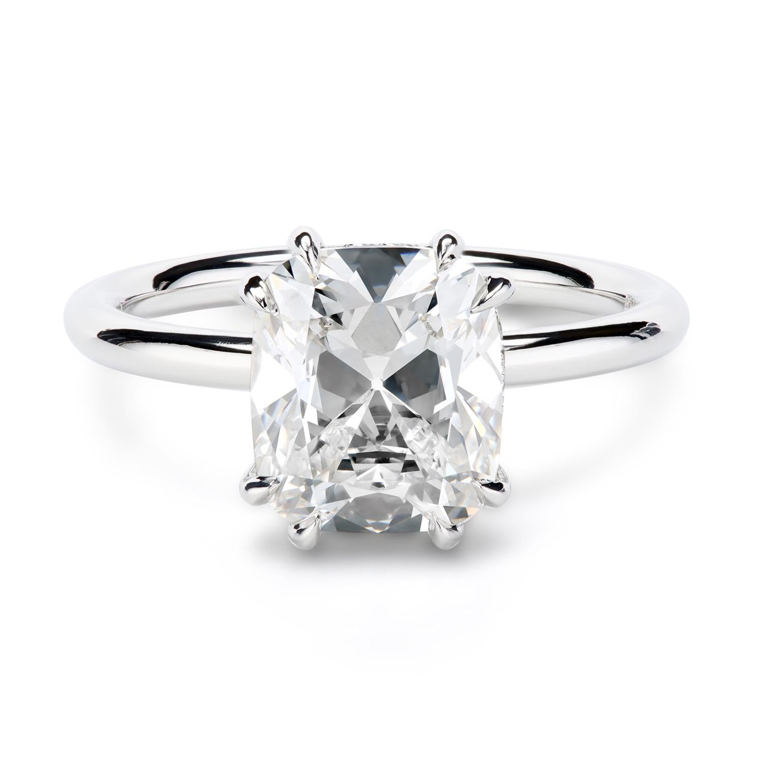 The Leon Mege hand-forged 410™ solitaire features a cushion diamond sitting on a diamond-studded upper gallery (