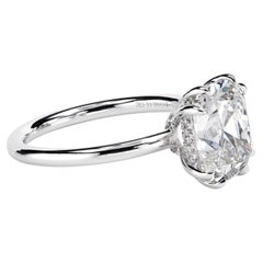 Used Leon Mege platinum hand-forged solitaire features a certified OMC diamond.