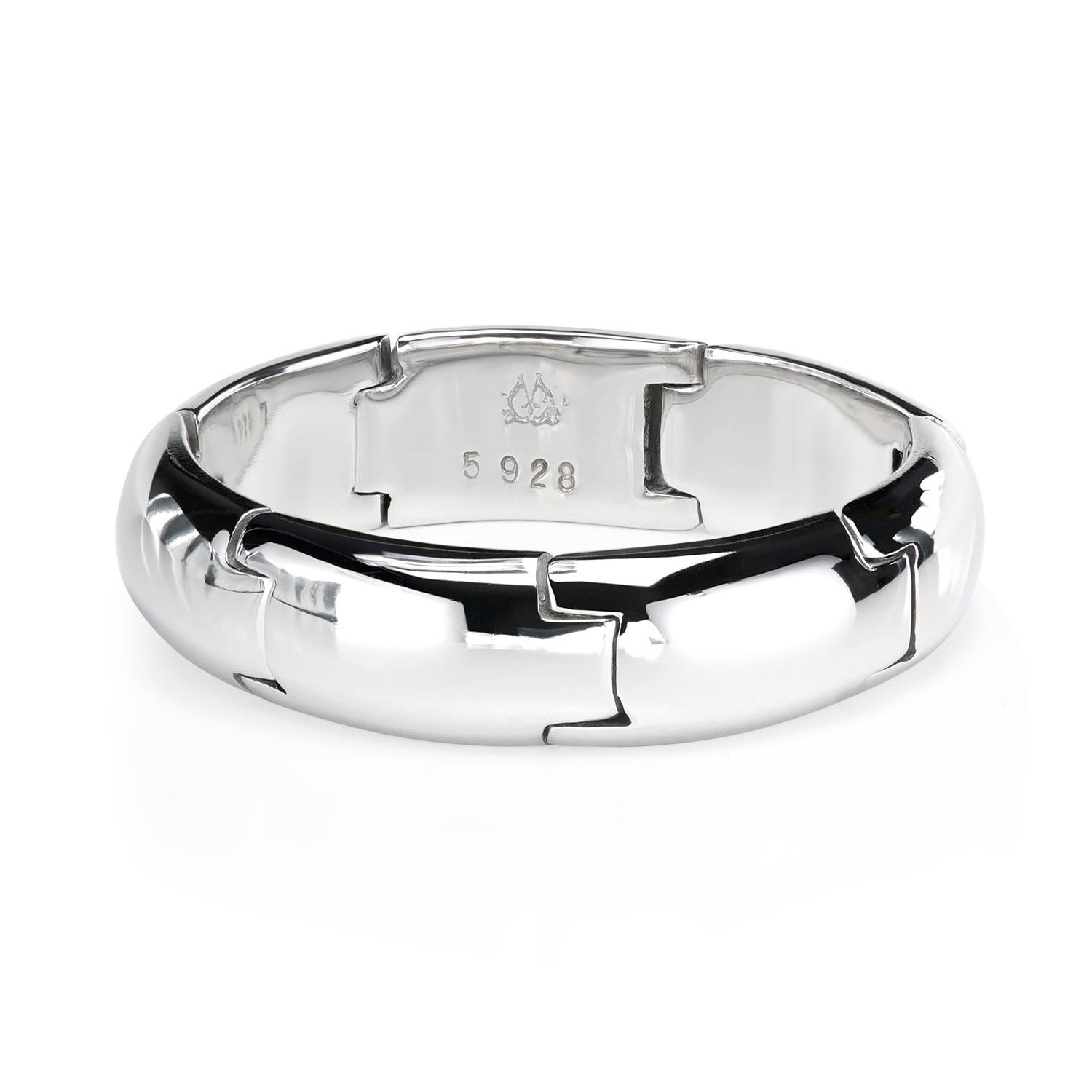 The articulated wedding band is designed to keep fingers in a feather-like soft comfort thanks to the hinged joints, relieving pressure points under duress. 

Wedding Band Guide
5.8 mm width
Finger size: 9 1/2
Rolex-grade platinum
Smooth chamfered