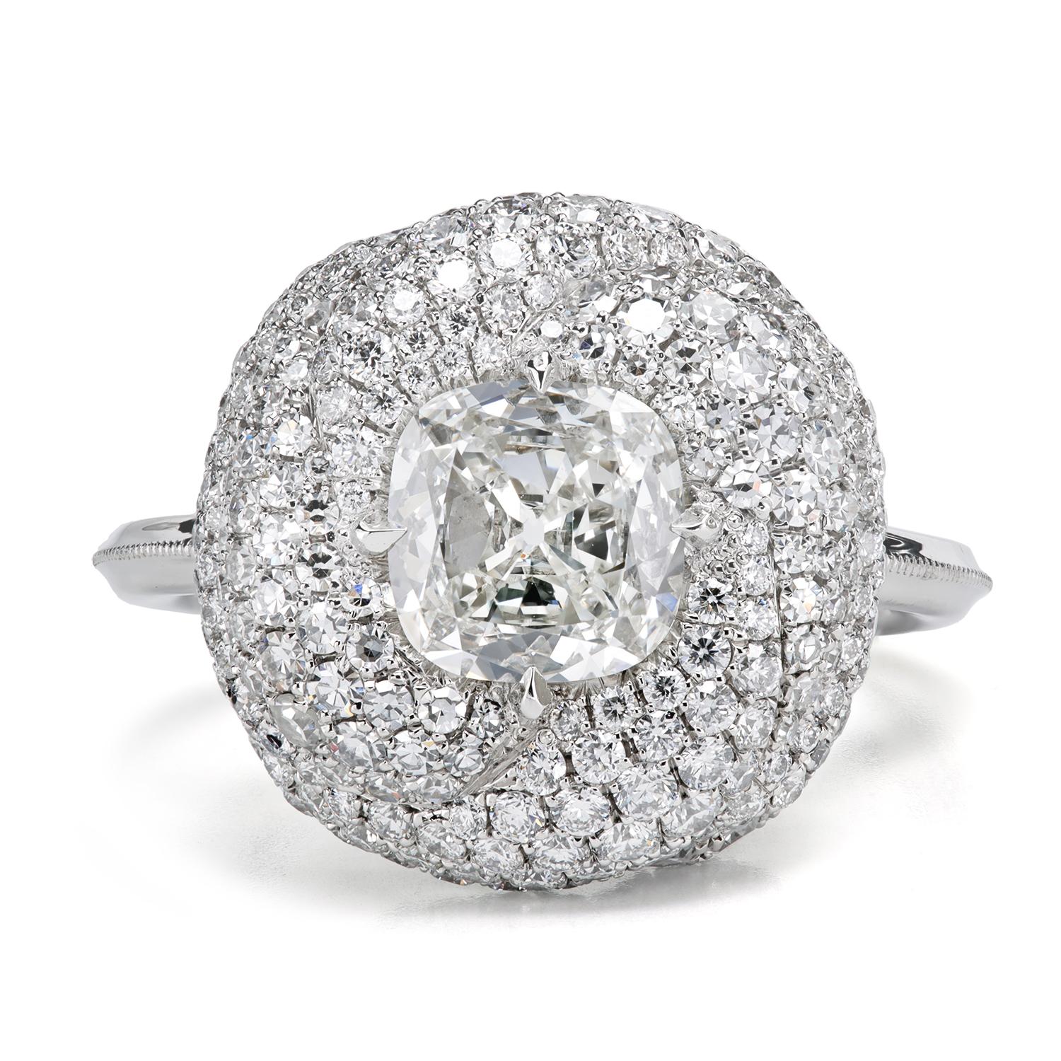 Sleek and stylish diamond ring embodies the strength and resilience of true love. The beautiful pave-set folds enclosing the center stone 
are lined with single and full-cut diamonds with a breathtaking results.

0.92 ct F/VS1 True Antique™ Cushion