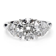 Leon Mege platinum three-stone ring with round and heart-shape diamonds