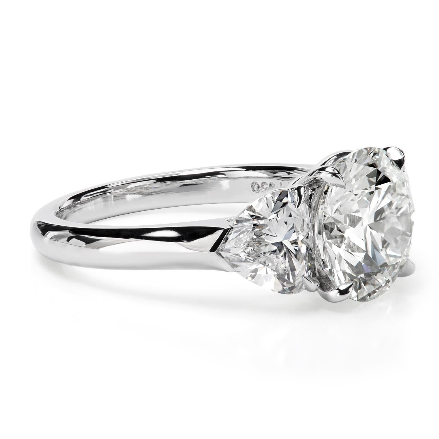 Contemporary Leon Mege platinum three-stone ring with round and heart-shape diamonds   For Sale