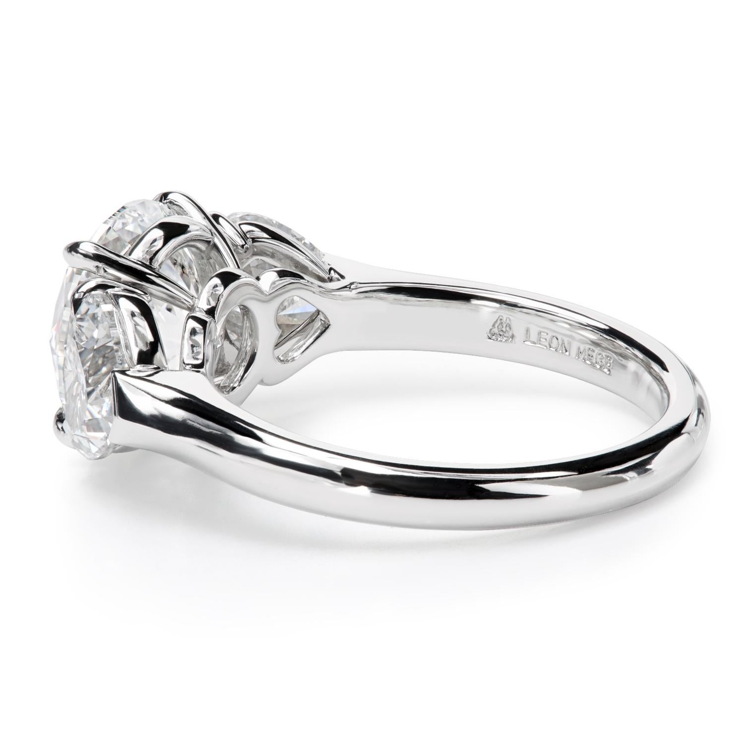 Round Cut Leon Mege platinum three-stone ring with round and heart-shape diamonds   For Sale