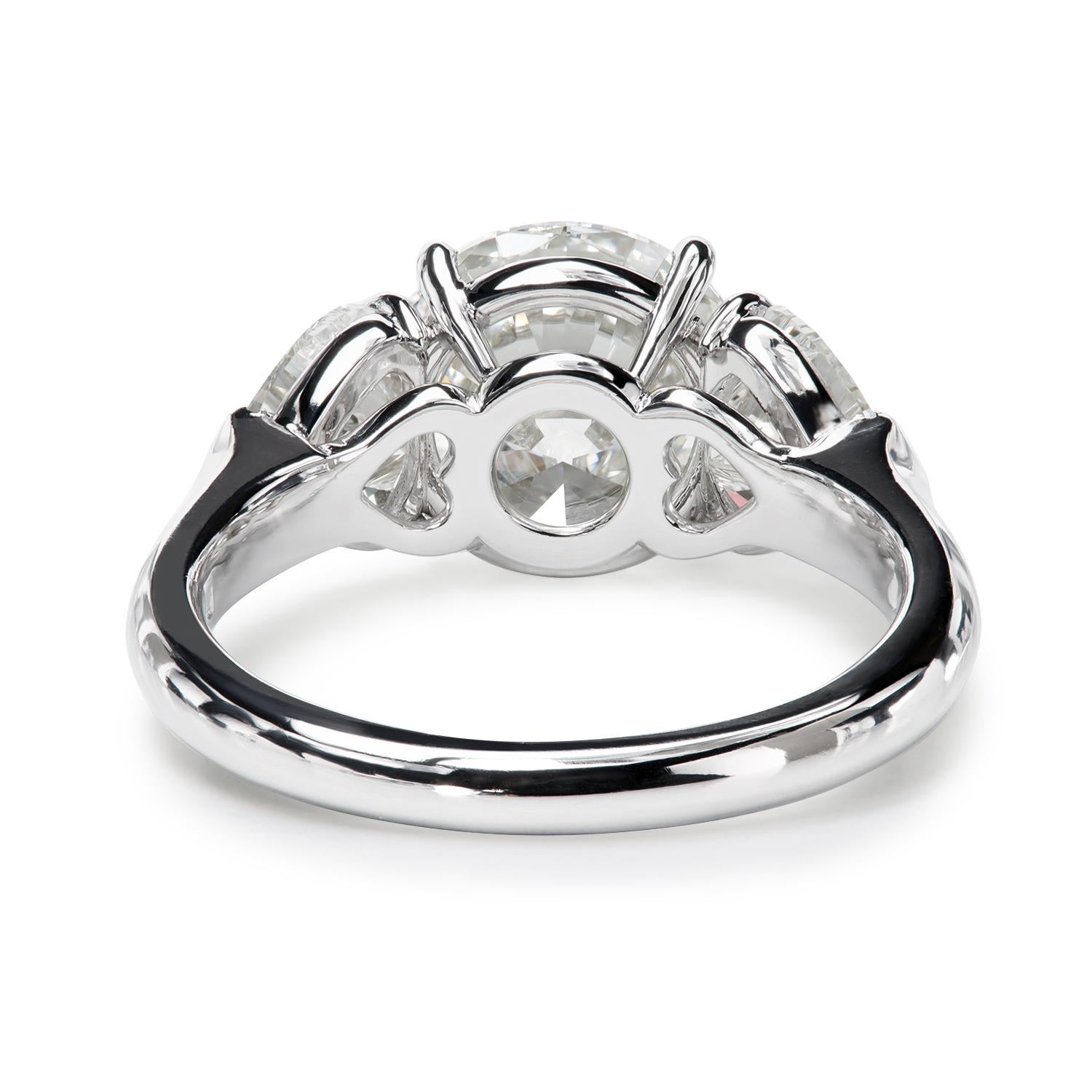 Leon Mege platinum three-stone ring with round and heart-shape diamonds   In New Condition For Sale In New York, NY