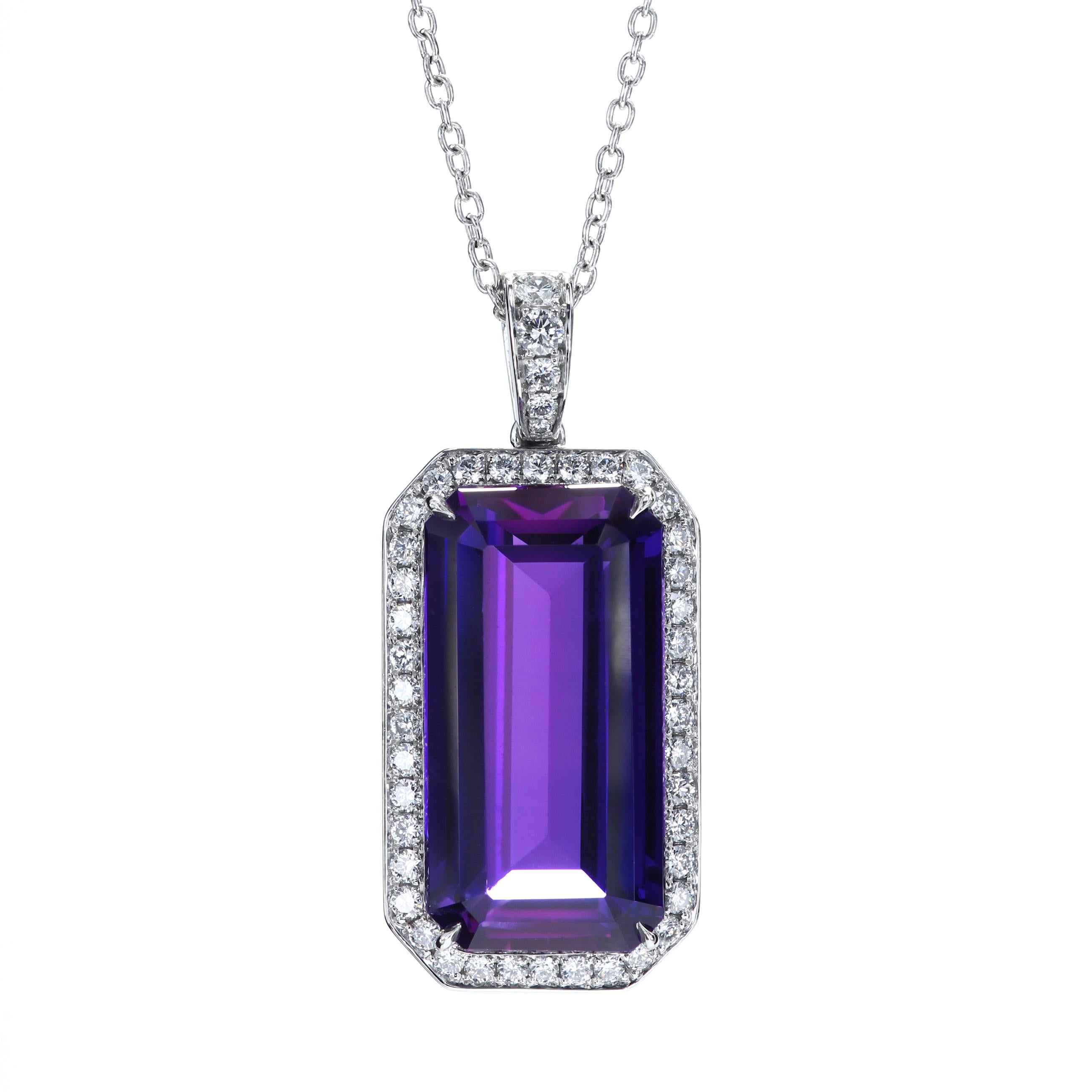 10.6 carats natural vivid emerald-cut amethyst set with 45 F/VS round diamonds in a platinum pendant.
Overall pendant's dimensions 20.8 mm x 12.1 mm
45 ideal cut diamonds F/VS 0.45 carat total weight
Smooth edge bright-cut pave (millgrain edge can