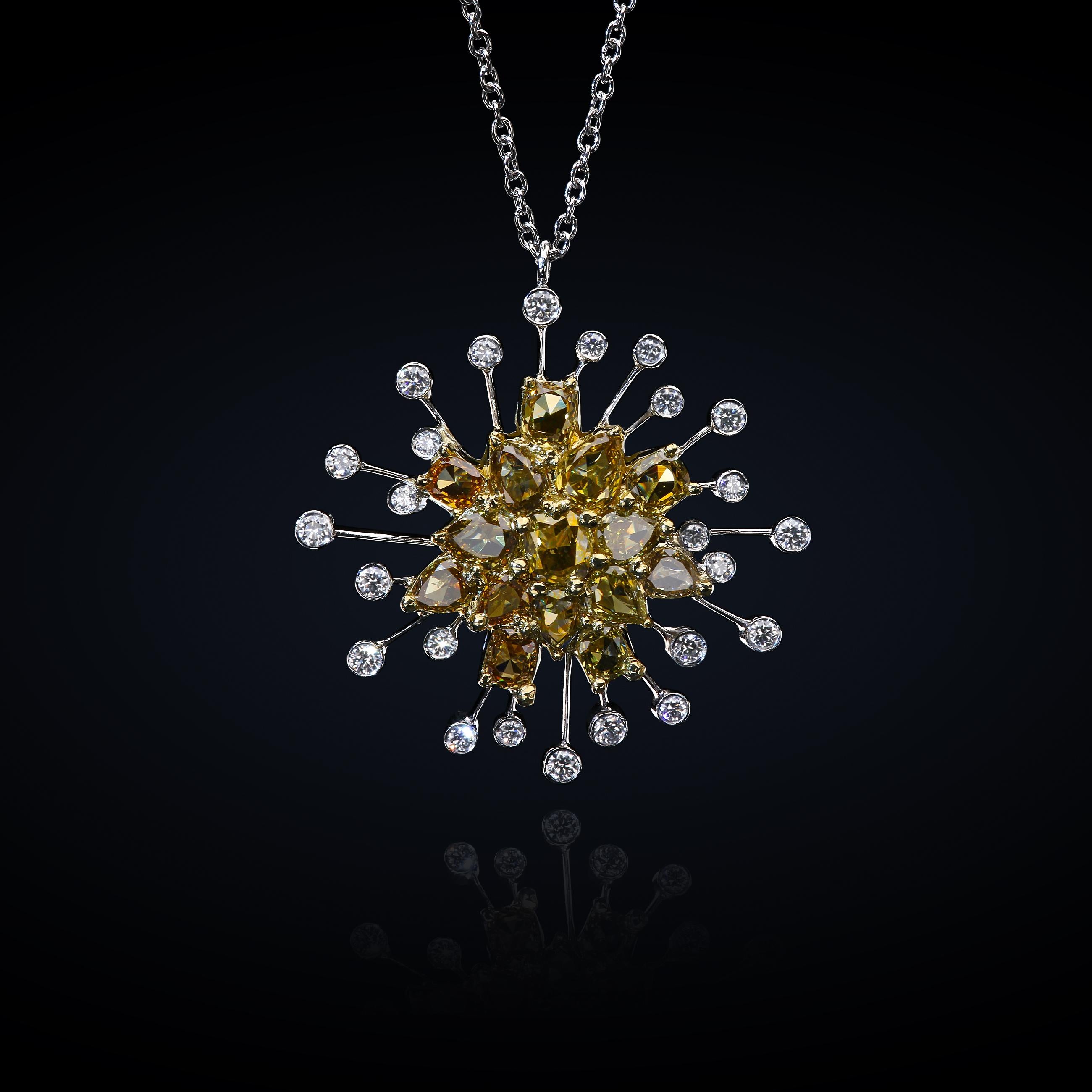 Platinum and 18K yellow gold pendant set with natural Caramel Diamonds™ in the center, and white full-cut diamonds bursting at the center.
The pendant is suspended on an 18