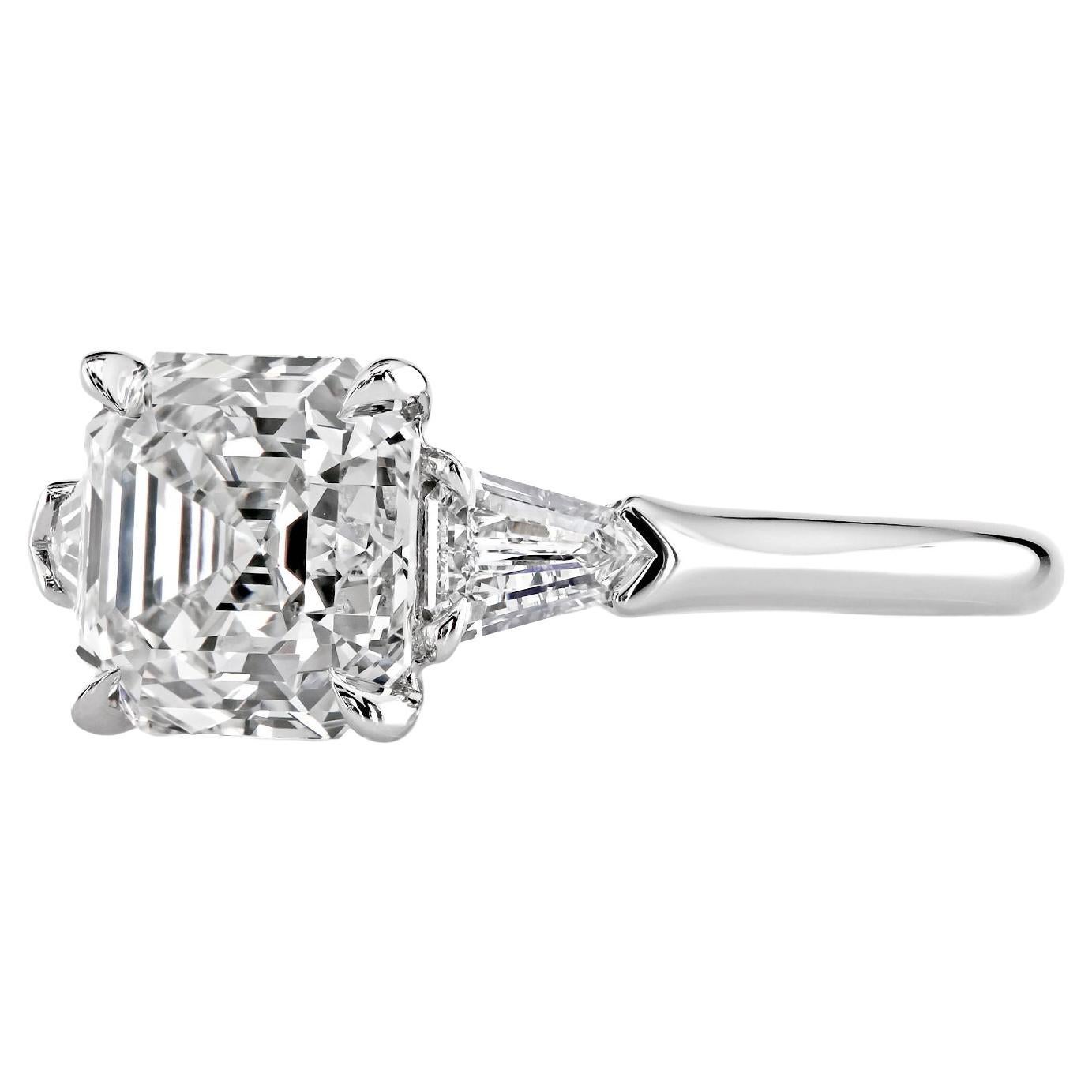 Leon Megé bespoke three-stone engagement ring unmatched by other pairings and featuring an Asscher-cut diamond of graceful beauty.

1.83 ct Asscher cut natural diamond
Elongated diamond bullets
Single claw prongs
Rolex-grade platinum

The lead time