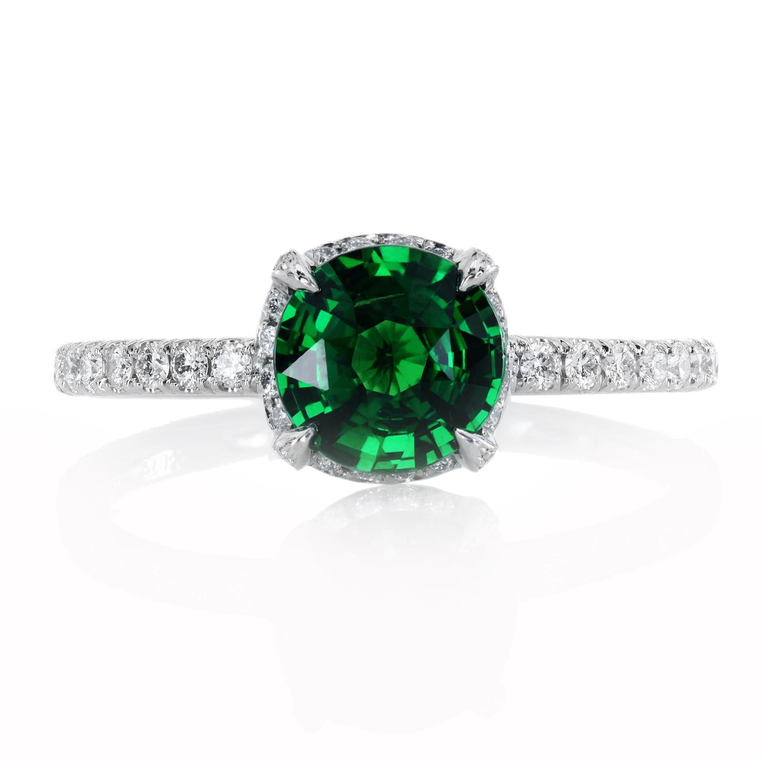 The vivid-green 1.06-carat tsavorite has been cut into a masterfully balanced gem and has excellent clarity with only minor inclusions typical for such material. The gemstone is set in a custom-designed micro-pave platinum ring with 84 ideal cut