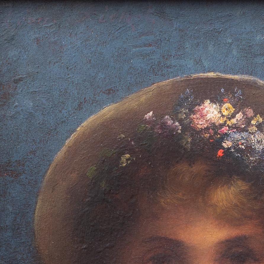Introducing a stunning portrait by renowned French artist Léon Richet (1847-1907), depicting a young girl adorned with a beautiful floral wreath and a hat perched atop her head. This small yet captivating painting showcases Richet's mastery of the
