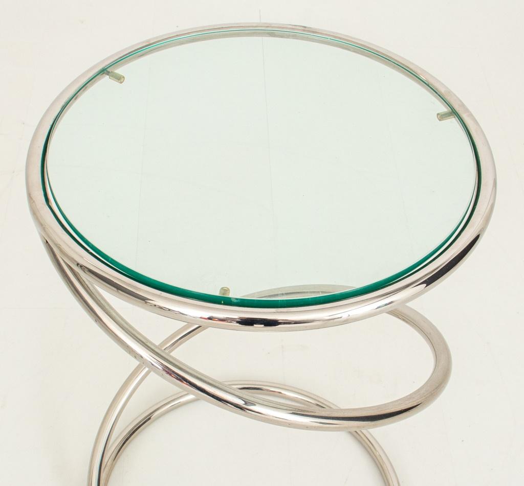 Leon Rosen (American, XX)  for Pace (Attr.) chrome and glass coil table, the circular top centering a glass plate, supported by a chrome coil to circular base. 

Dimensions: 19