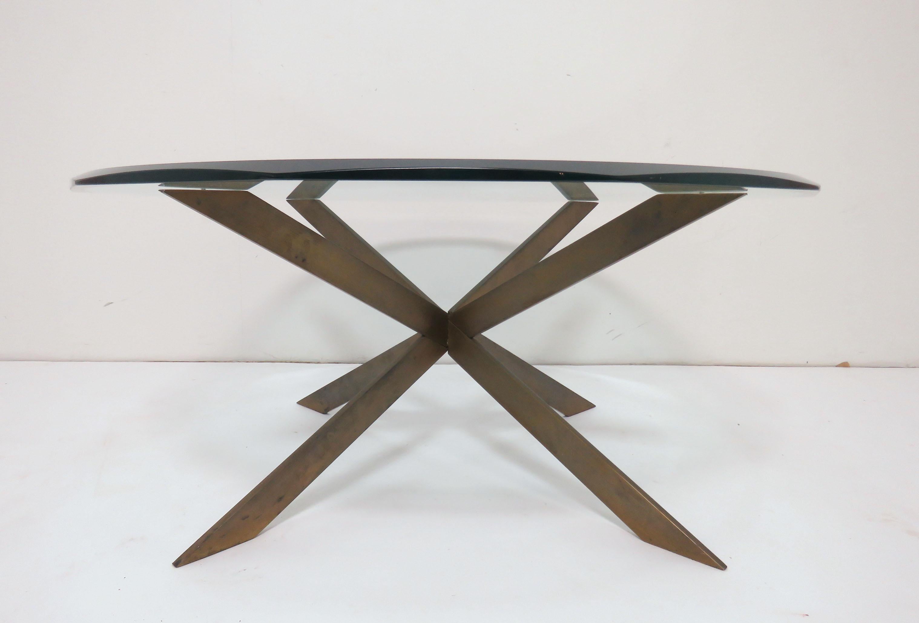 Coffee table by Leon Rosen for Pace with a bronze double X-form / starburst base and original beveled glass top, circa 1970s.