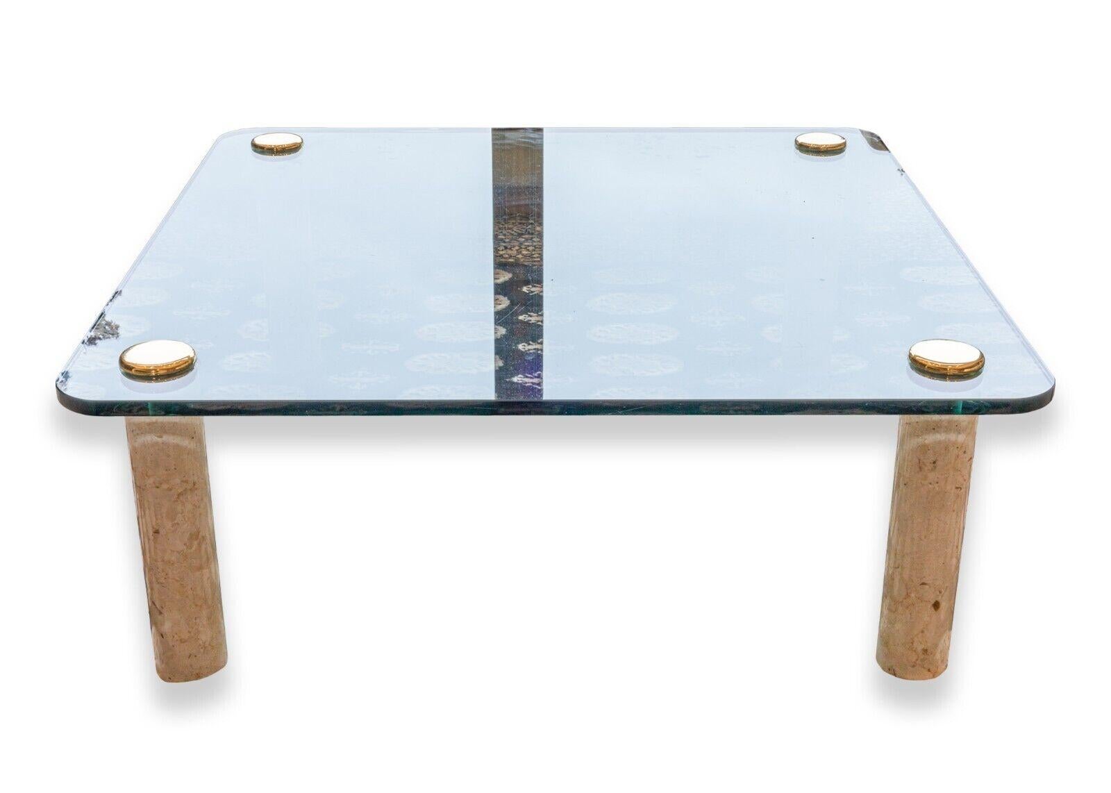 A Leon Rosen for Pace contemporary modern glass, marble, and brass coffee table. A beautiful coffee table featuring a thick cut square glass table top with rounded corners, gorgeous marble cylinder legs, and brass leg toppers. This table is in very