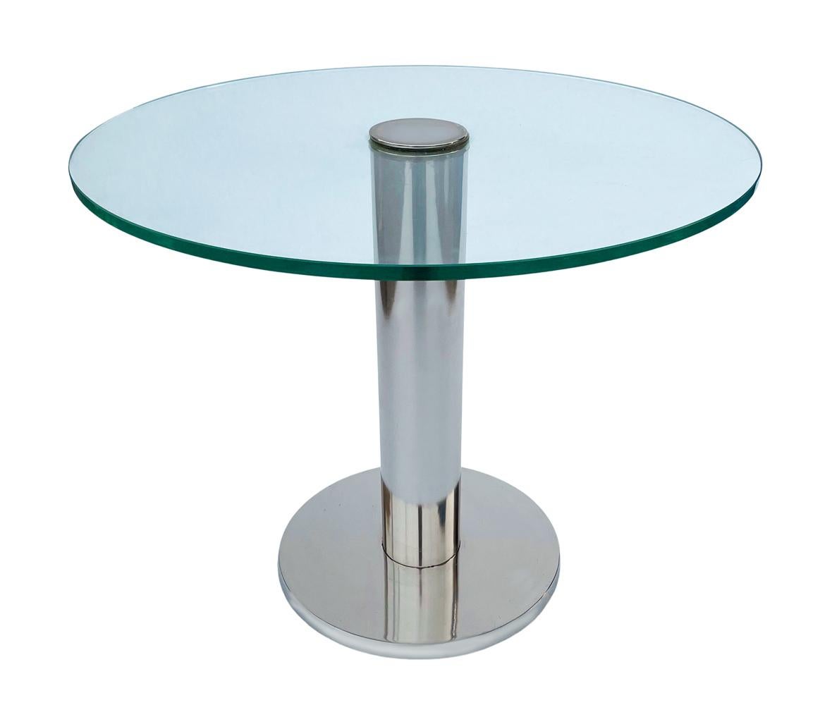 A modern classic designed by Leon Rosen for Pace Collection. It consists of chrome plated steel with thick clear glass top.