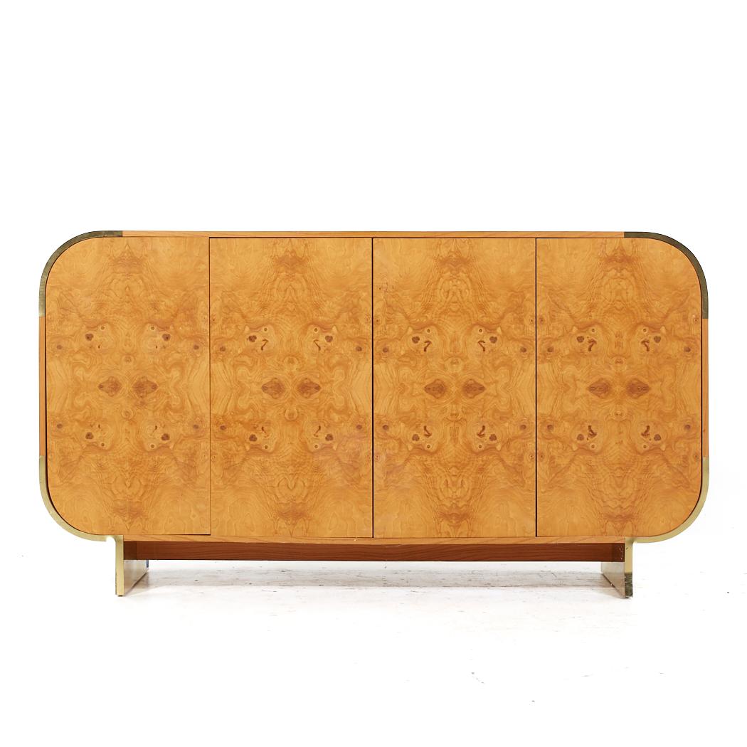 Leon Rosen for Pace Style Mid Century Brass and Burlwood Credenza

This credenza measures: 71.75 wide x 19.75 deep x 39.5 inches high

All pieces of furniture can be had in what we call restored vintage condition. That means the piece is restored