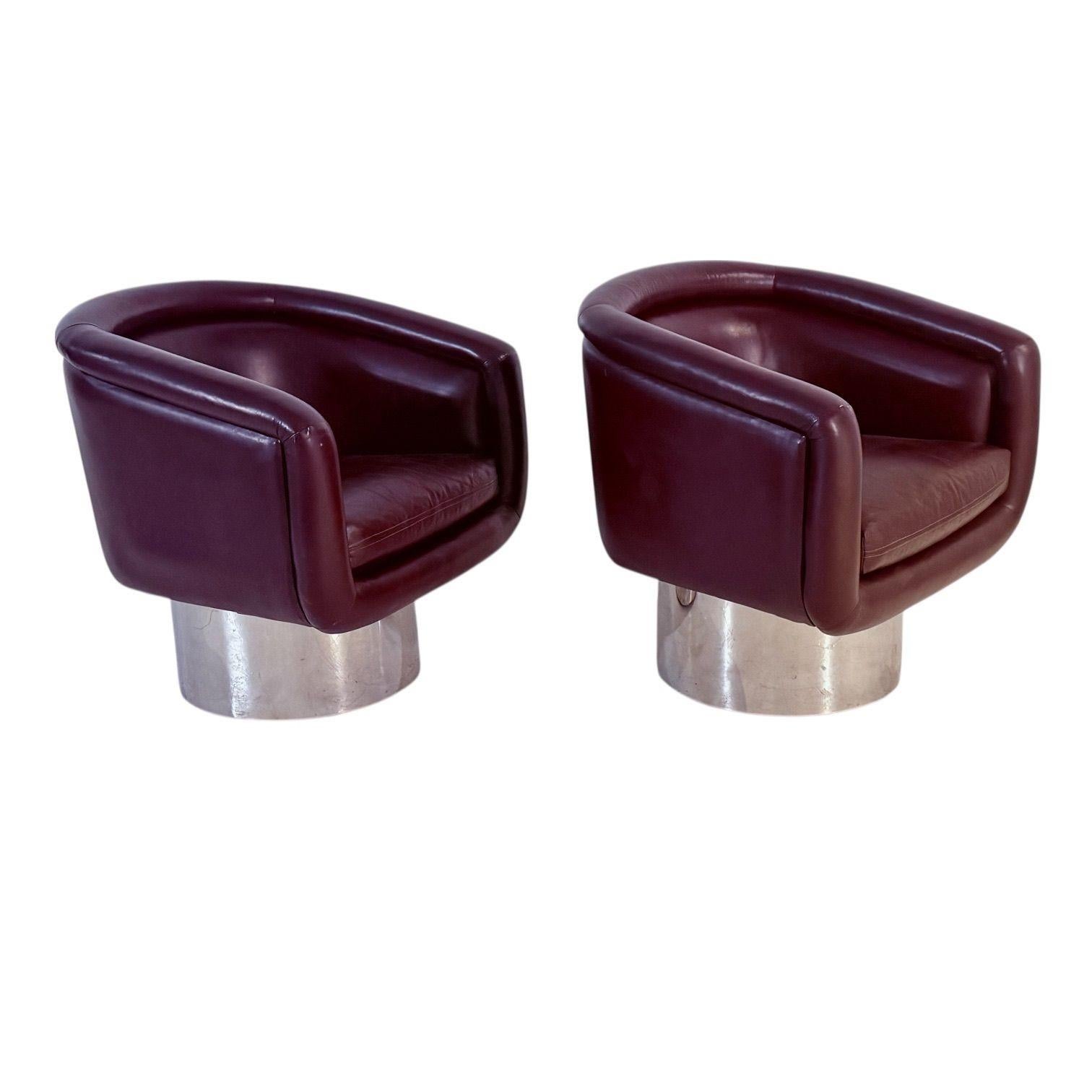 Leon Rosen for PACE Swivel Lounge Chairs, 1970’s.  Gorgeous maroon Leather on Chrome cylinder bases.  There is a small tear as shown in pic.
Measures 31” tall 30” wide 28” deep seat height 19” 21” deep arm height 28”