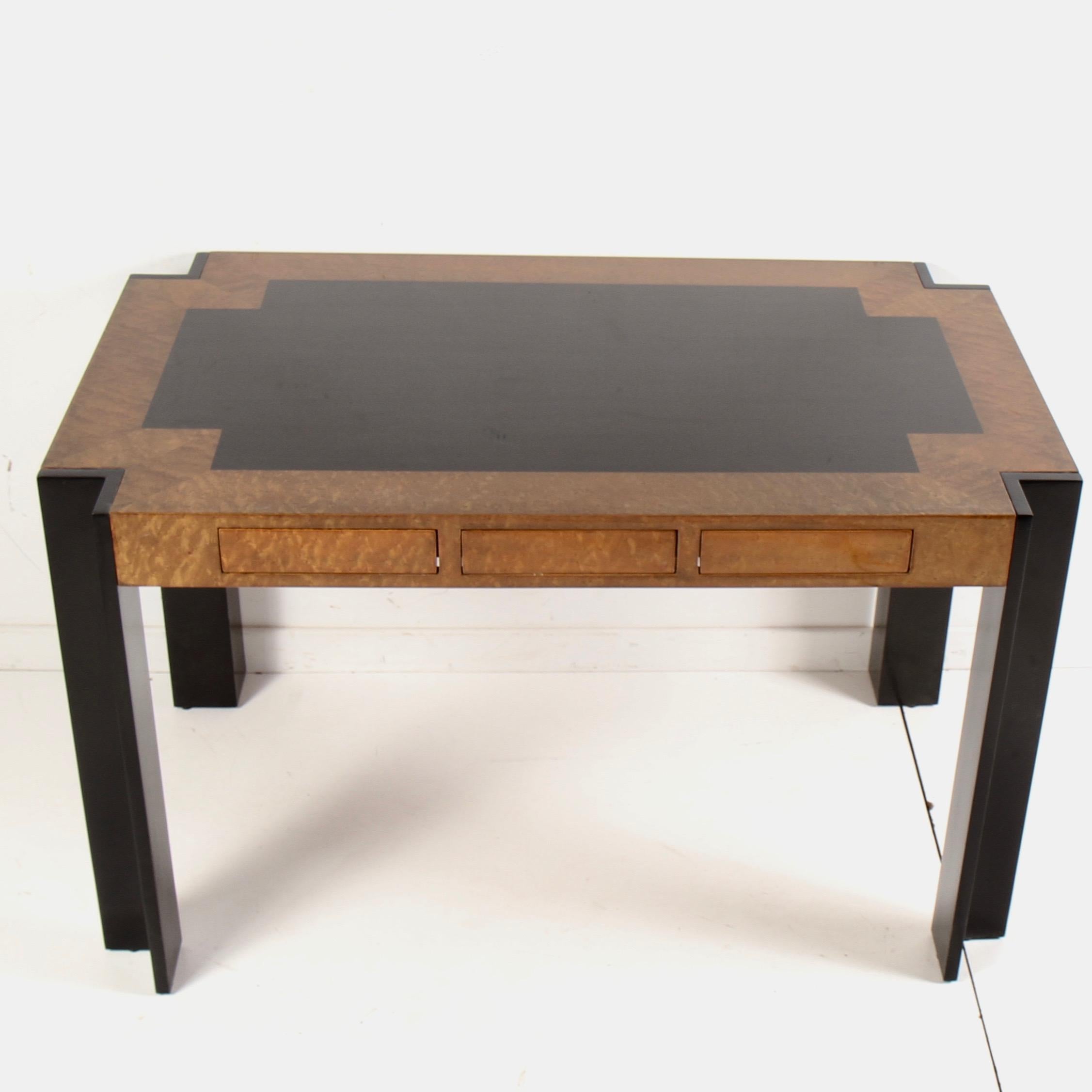 Leon Rosen designed desk for The Pace collection with contrasting ebony and burl veneers. Three center drawers are spring loaded and open with just a touch. Just refinished in slightly darker than original finish.
