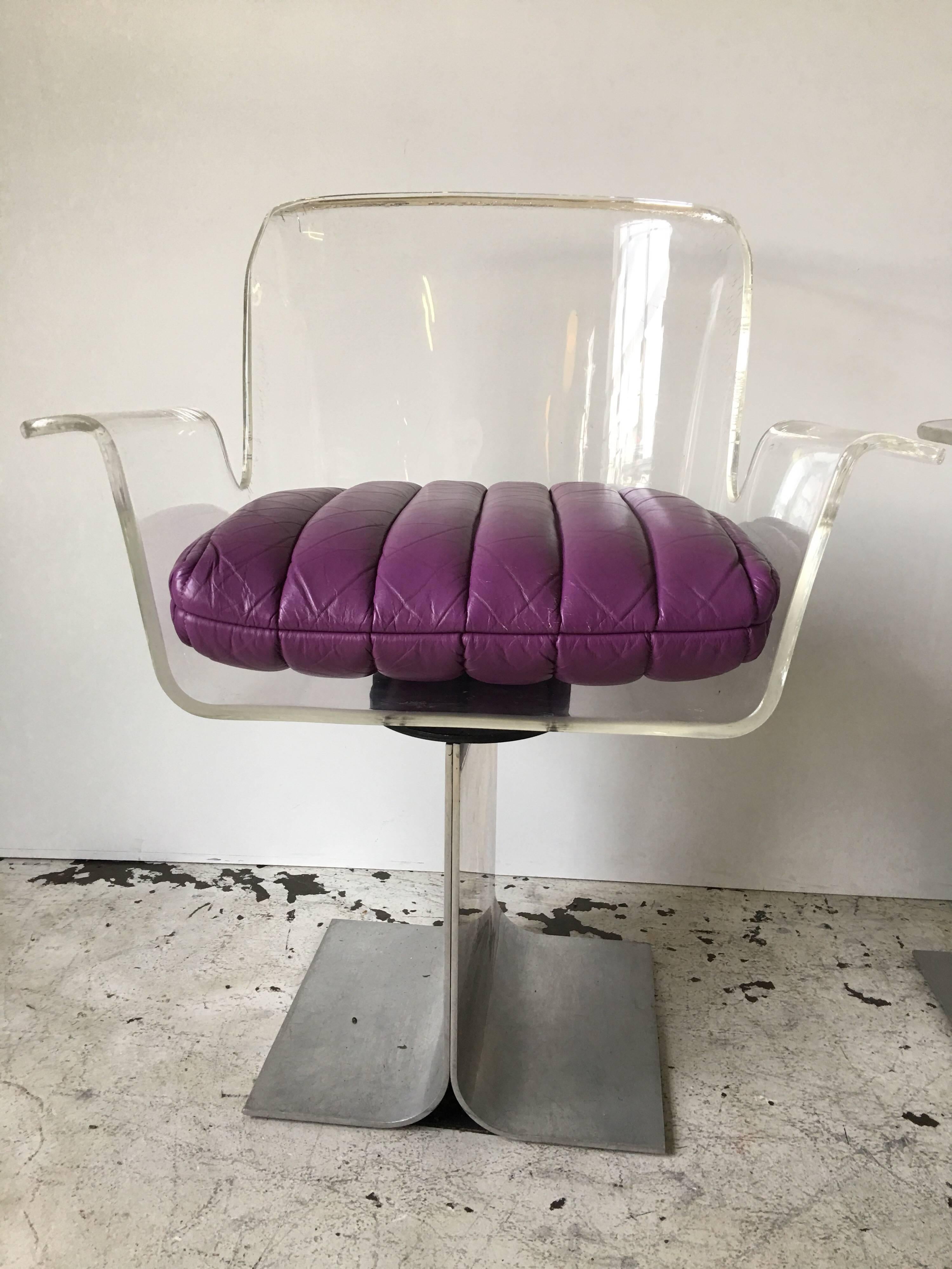 This is for a pair of dramatic curving armchairs in Lucite or acrylic for Pace Collection. They come with original purple channeled leather seat cushions, which add an additional 4