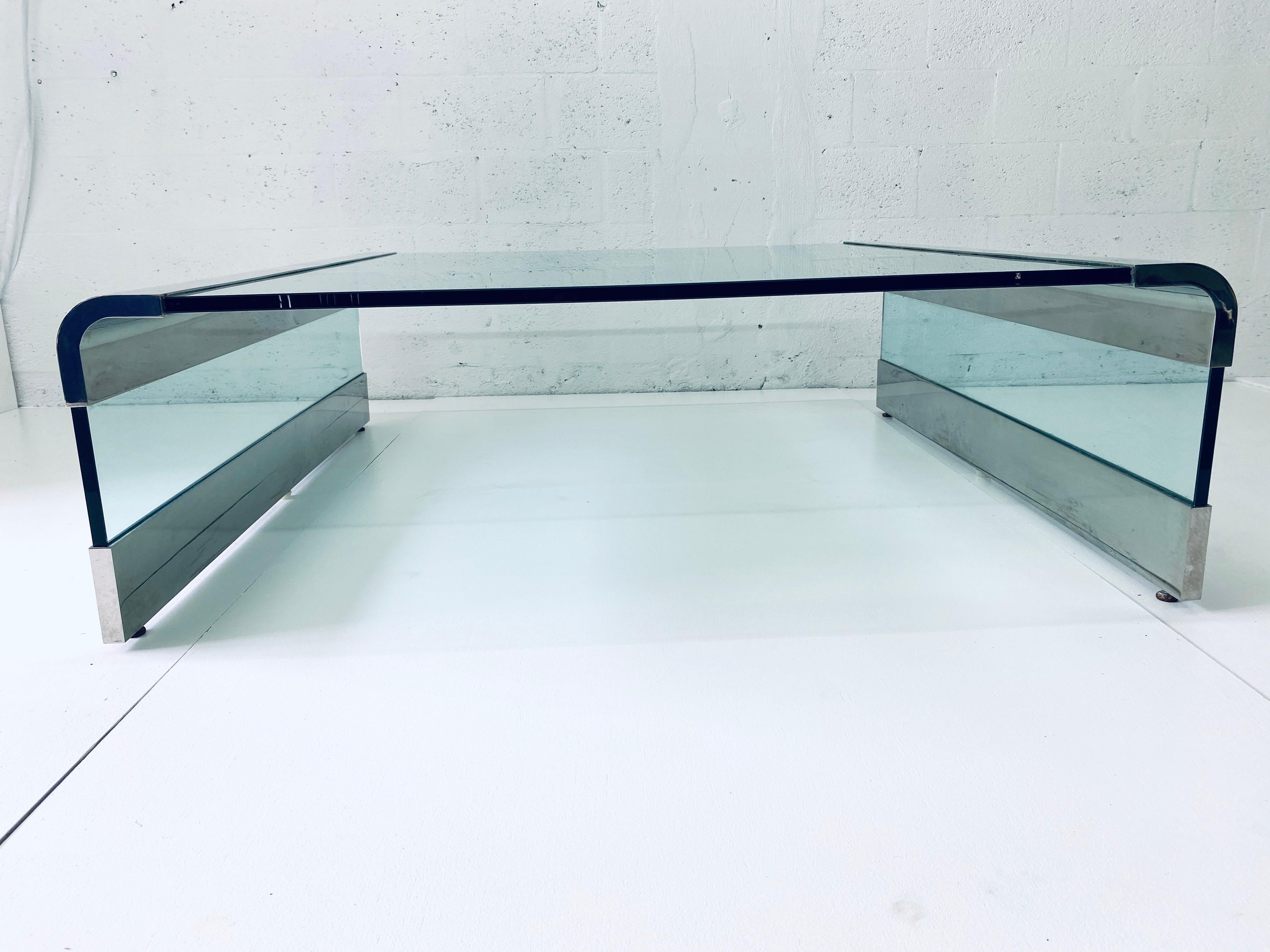 Original Leon Rosen for Pace collection waterfall glass and polished chrome coffee table from the 1970s.