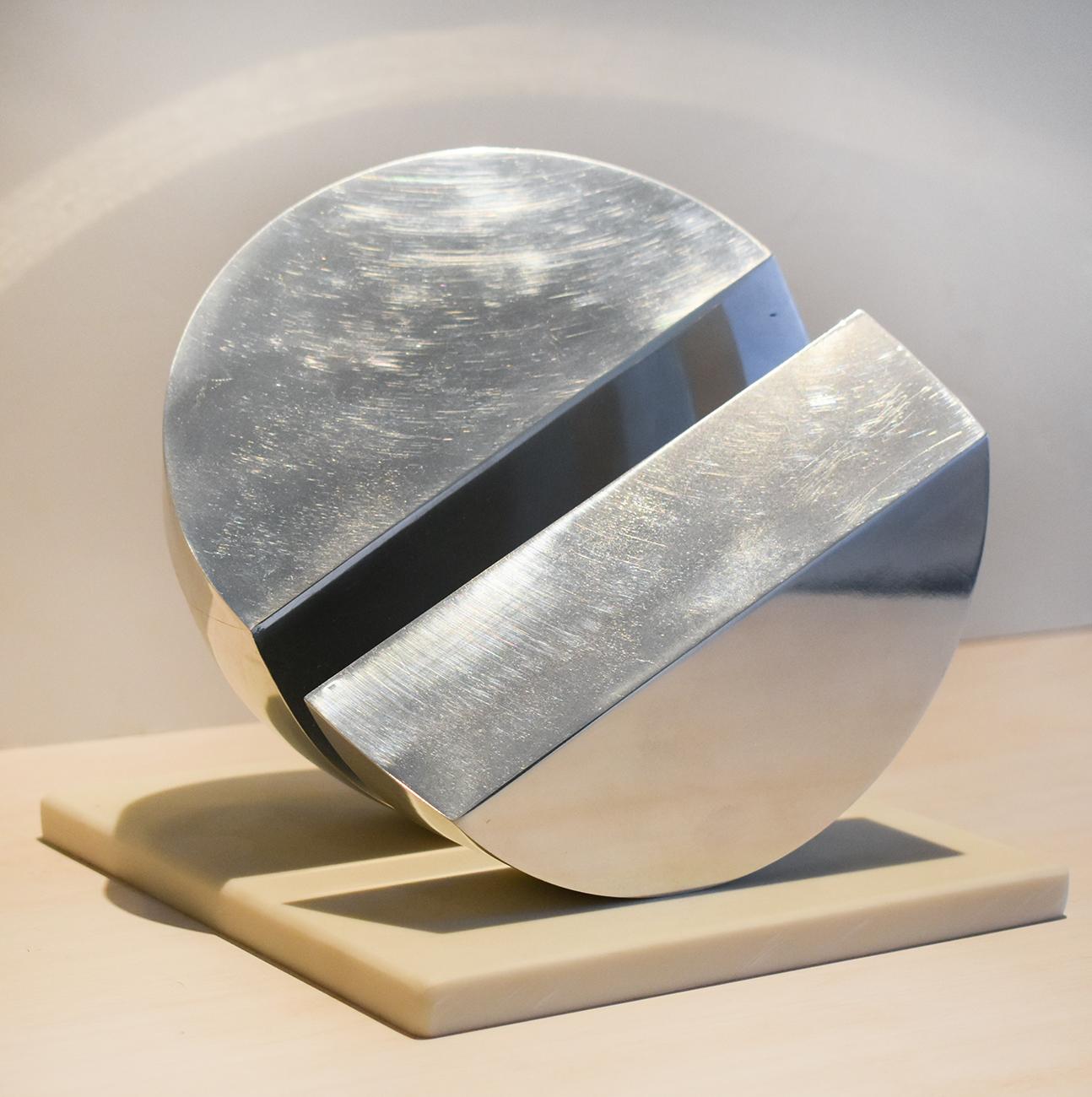 Small abstract, minimalist mid century modern style sculpture 
Silver colored polished stainless steel and marble base
7 x 6 x 6 inches
Marble base measures 7 x 7 inches
Sculpture weighs about 15 lbs. 

This small, contemporary abstract silver