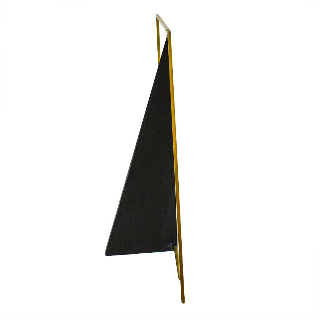 Small abstract mid century modern style in mahogany and brass
10 x 9 x 2 inches
warm toned mahogany base with geometric brass detail 

This delightful, contemporary minimalist sculpture made of polished brass and mahogany is perfectly suited for a