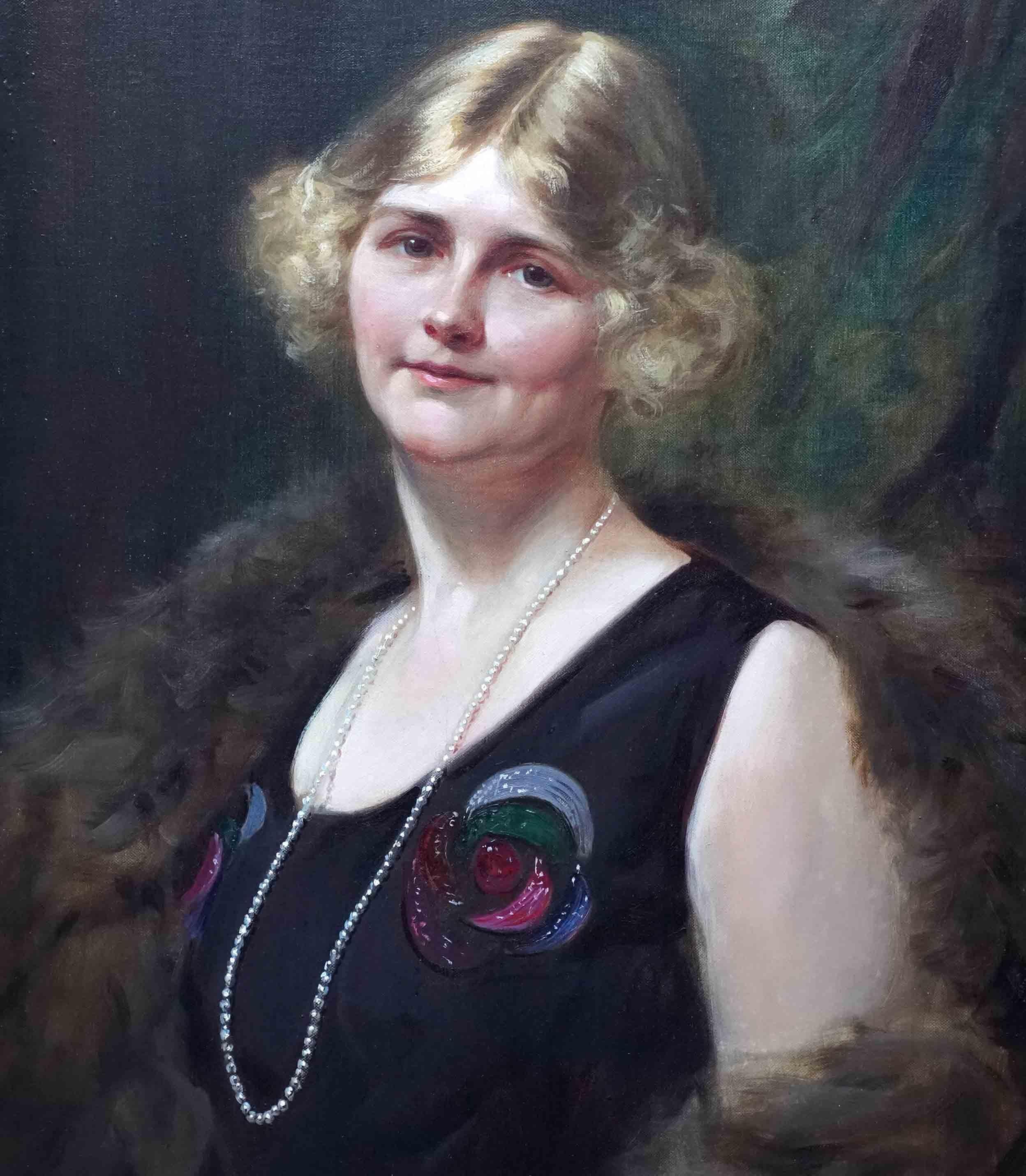 This lovely Art Deco portrait oil painting is by noted British prolific society portrait artist Leon Sprinck. Painted in 1924 it is a half length portrait of a beautiful blonde woman, stood smiling at the artist/viewer, her head tilted to one side.