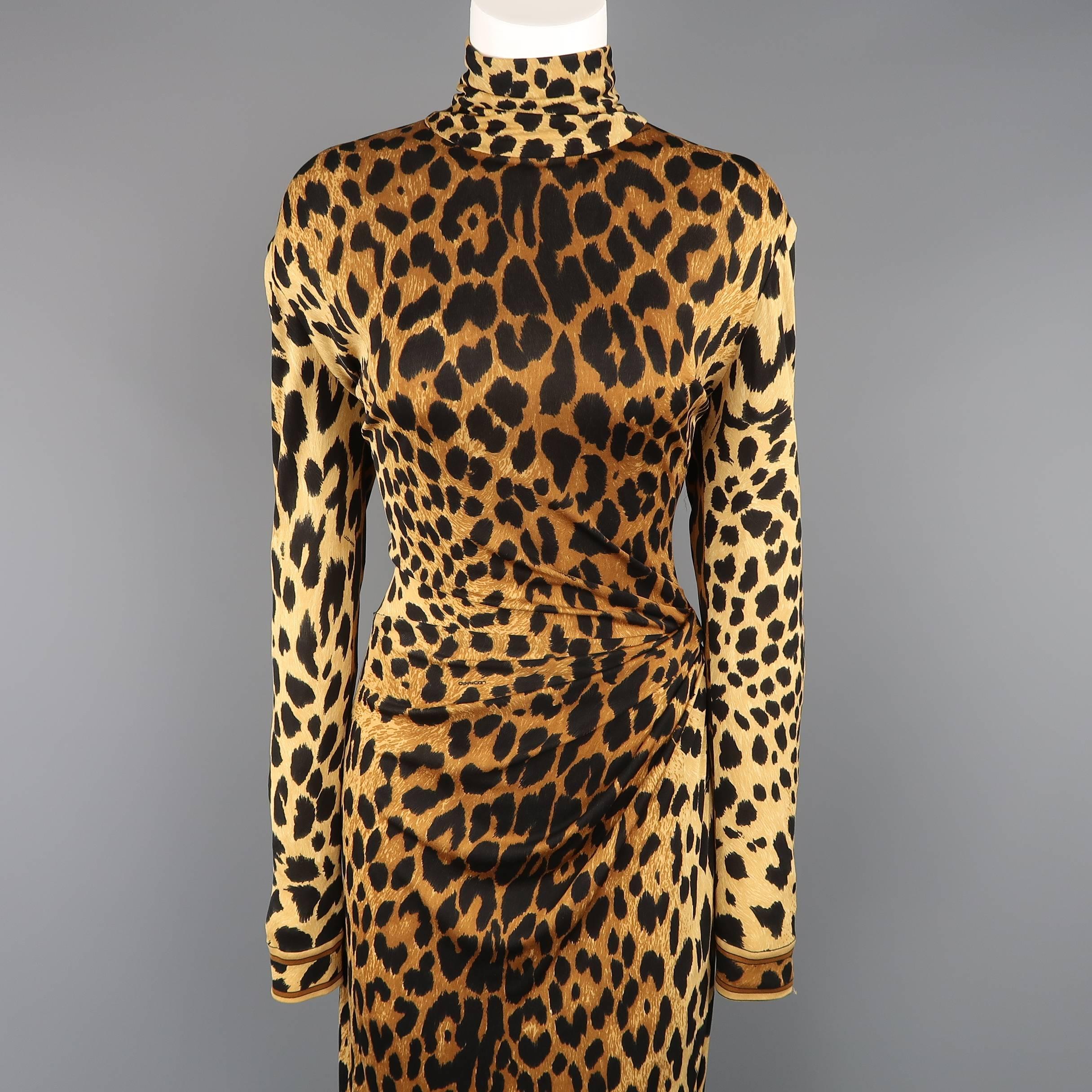 Vintage LEONARD - PARIS full length fitted cocktail dress comes in a tan cheetah print stretch jersey with a high neck, long sleeves, striped cuffs, side slit, and asymmetrical drape accented hip.
 
Good Pre-Owned Condition.
Marked: (no size tag)
