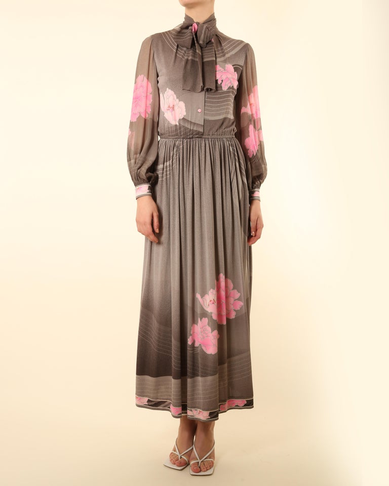 Leonard 1970's vintage button up maxi dress in water coloured grey with gradient pink, white and orange floral print
Composed of soft silk jersey
Pussy bow tie neck
Ruched cinched waist with plenty of stretch
Slightly sheer balloon style
